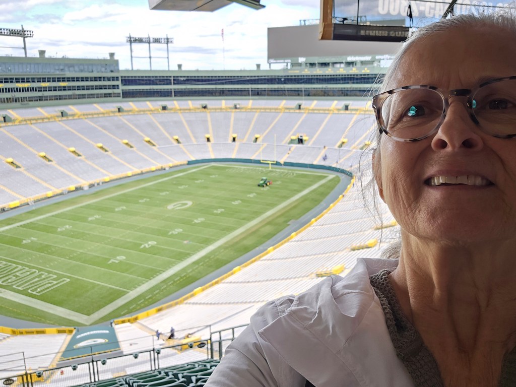 Inside Lambeau Field showing the seating bowl filled with fans
